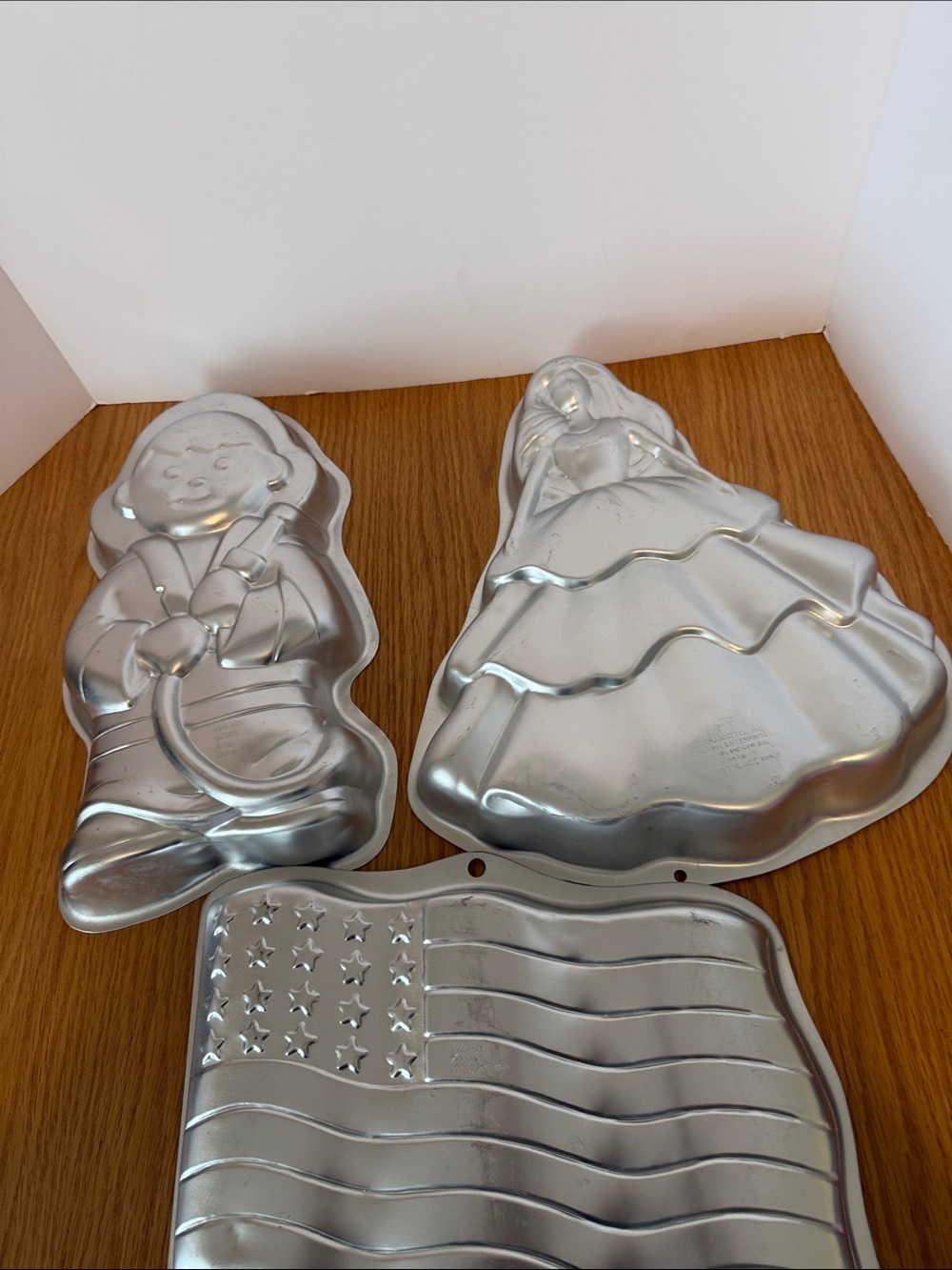 3 Wilton Cake Pans- fireman, American flag, and Barbie